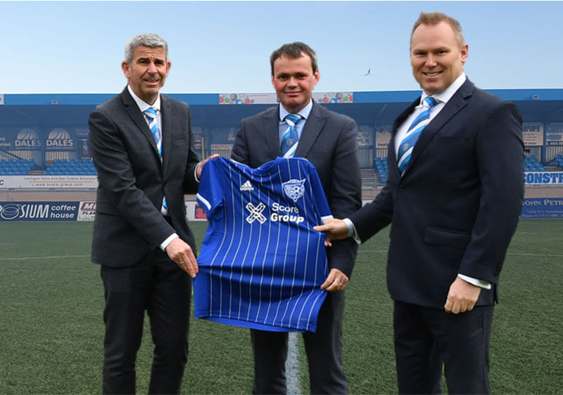 Ian Davidson Commercial Director Score Group, Scott Will Managing Director Score Europe and Gordon Ronaldson CEO Score Group proudly displaying the new Peterhead Football Club shirt
