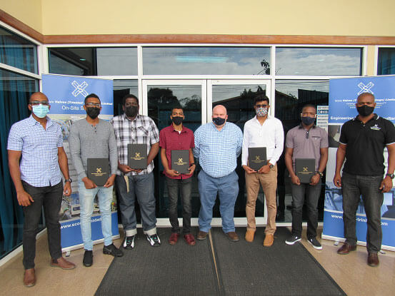 The time-served apprentices with local management and Training Coordinator.